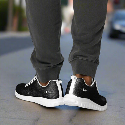 man walking in Black PowerStride Athletic Shoes