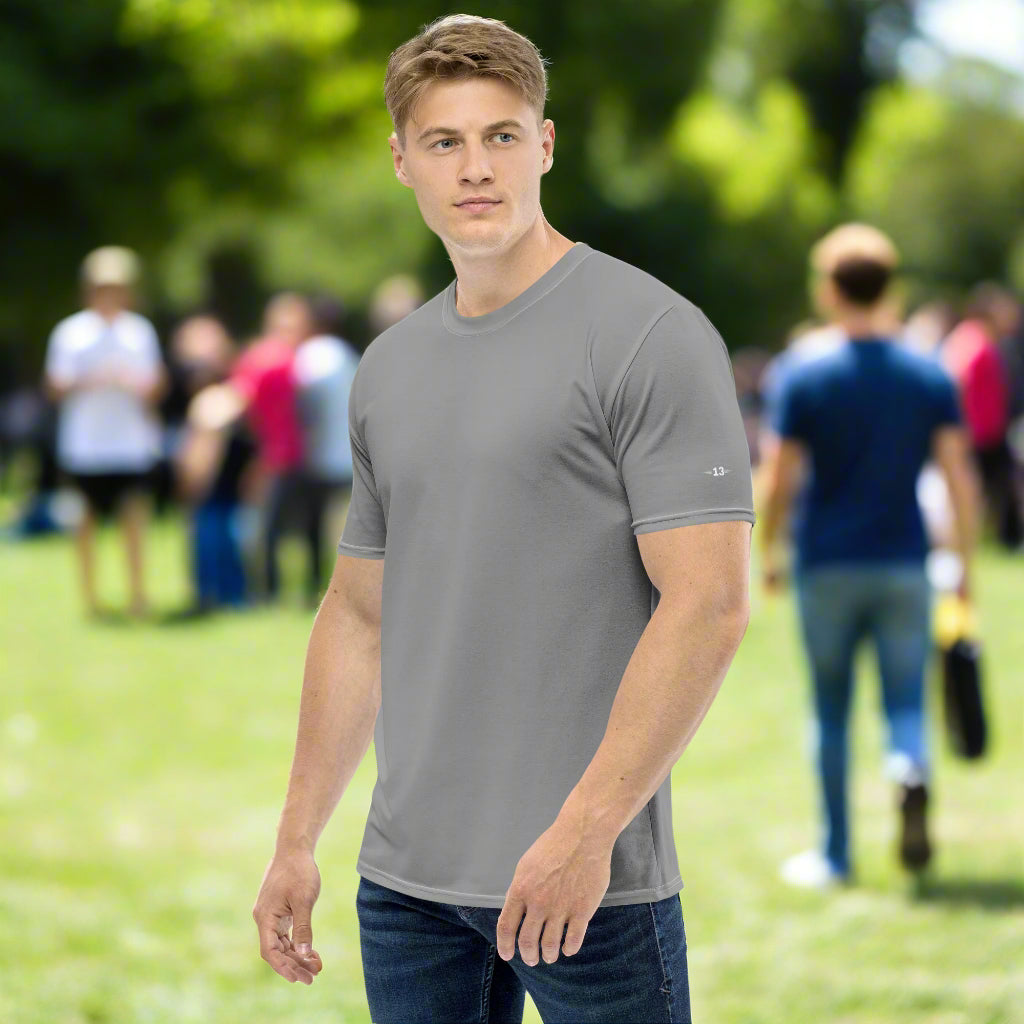 Man wearing Bold Essentials Crew Neck Tee in the park left side view