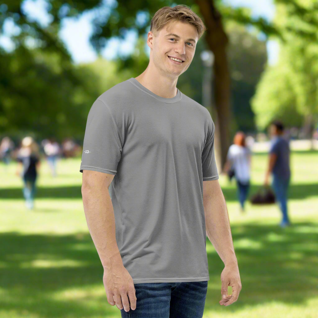 Man wearing Bold Essentials Crew Neck Tee in the park right side view