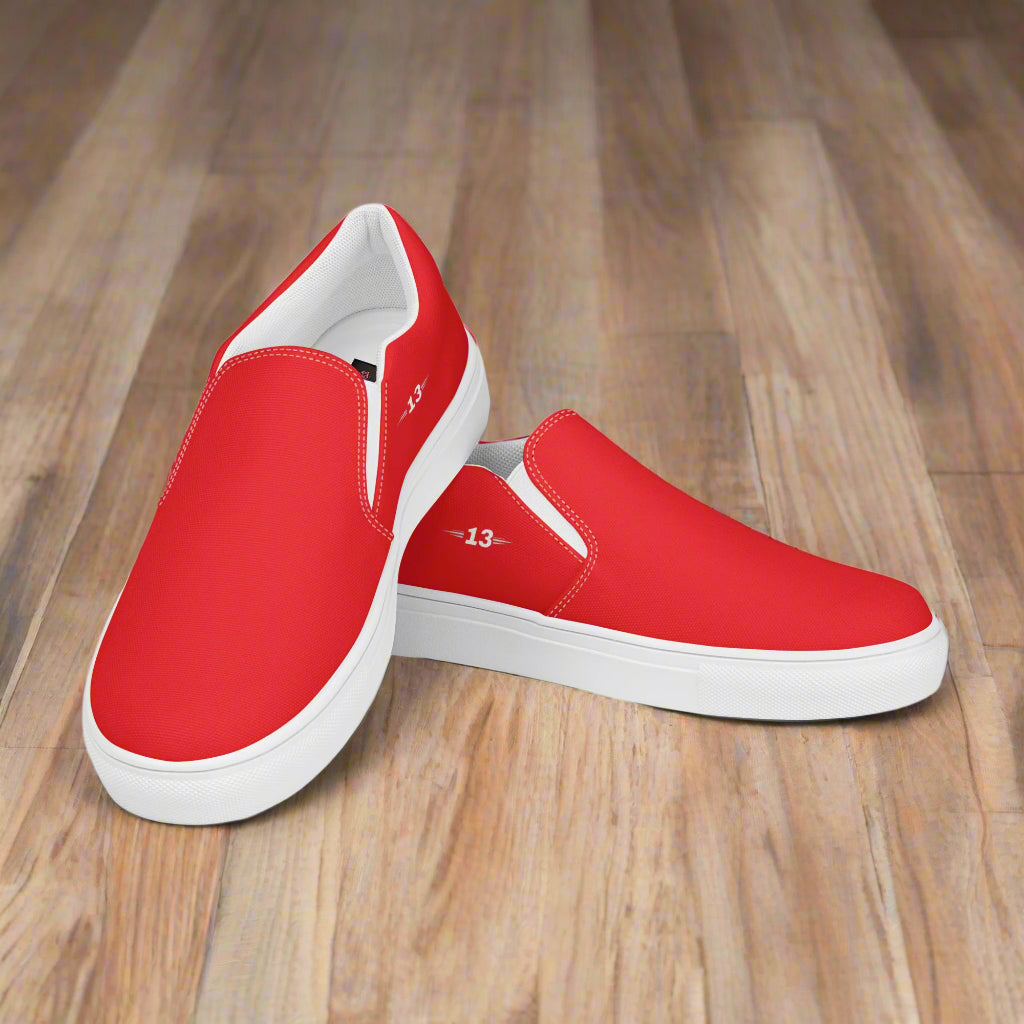 Crimson Glide Slip-Ons stacked on floor