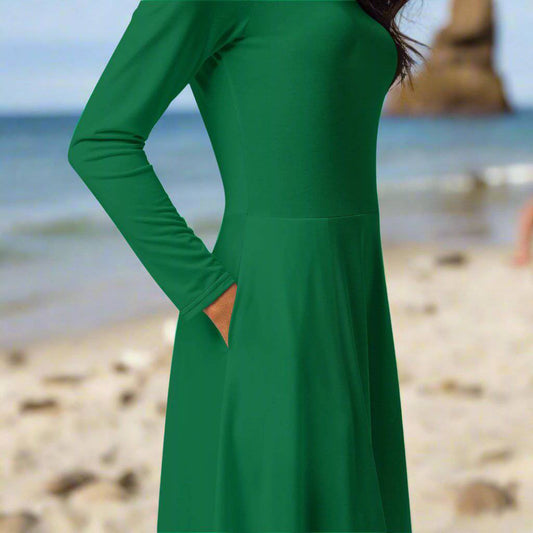 Side detail of the flowing skirt on the Evergreen Elegance Midi Dress, emphasizing fabric and fit.