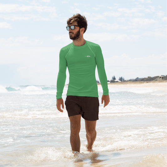 man wearing Evergreen Men’s Rash Guard at the beach