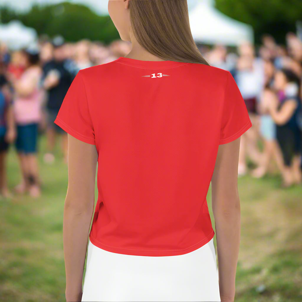 Woman wearing Fierce Scarlet Crop Tee at a crowded festival