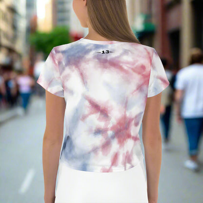 Woman wearing Freedom Flow Crop Tee in the city back view