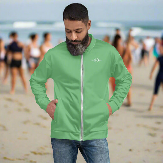 Man wearing sleek Fresh Glow Bomber Jacket at the beach