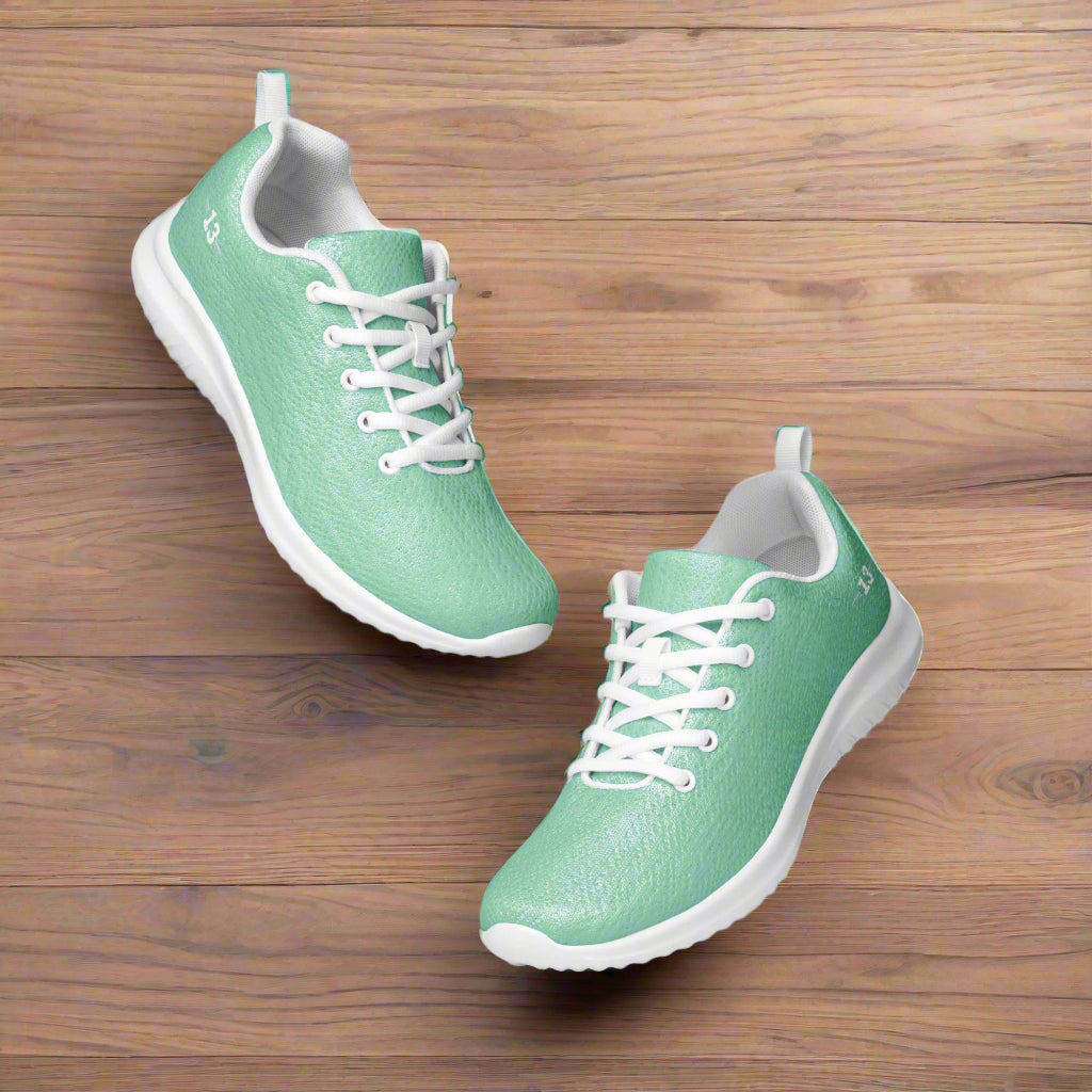 FreshStride Mint Athletic Shoes one in the air the other touching floor