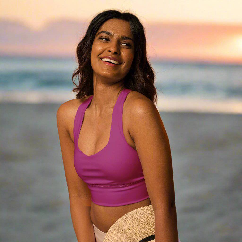 woman wearing Fuchsia Power Longline Sports Bra at beach