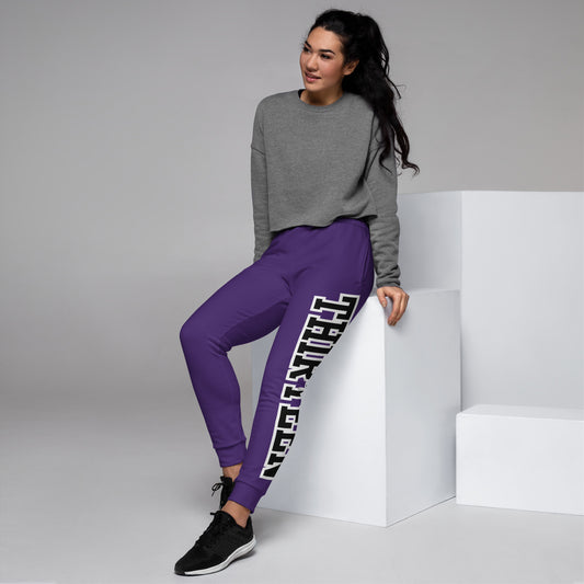 Model sitting and wearing LuxeStride Recycled Joggers