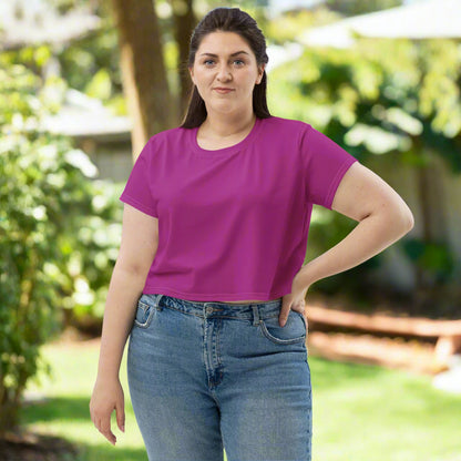 Woman wearing Magenta Muse Crop Tee in her backyard front view