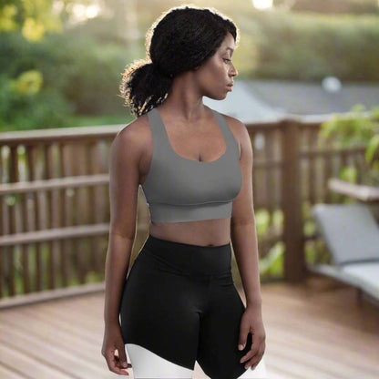 Woman wearing Radiance Longline Sports Bra Grey on poarch