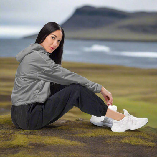 side view of a woman wearing Storm Gray Cropped Windbreaker in icelandic nature