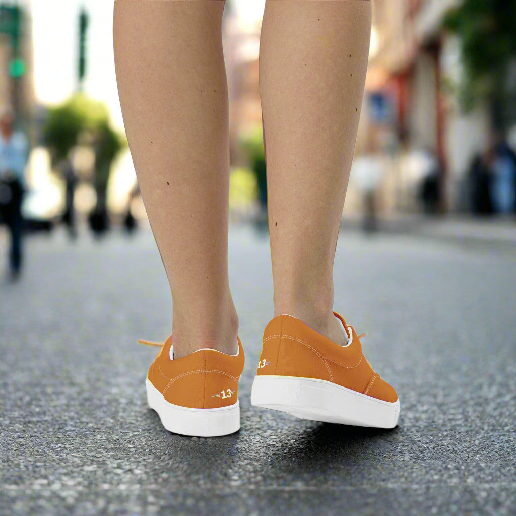 Back view of a woman walking in The Empower Lace-Ups