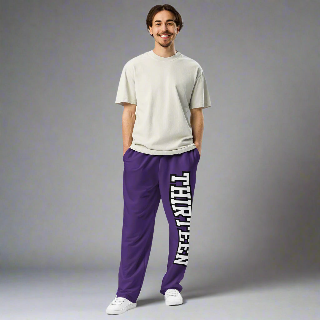 Front view of a man wearing Thirteen Unisex Purple Wide-Leg Joggers