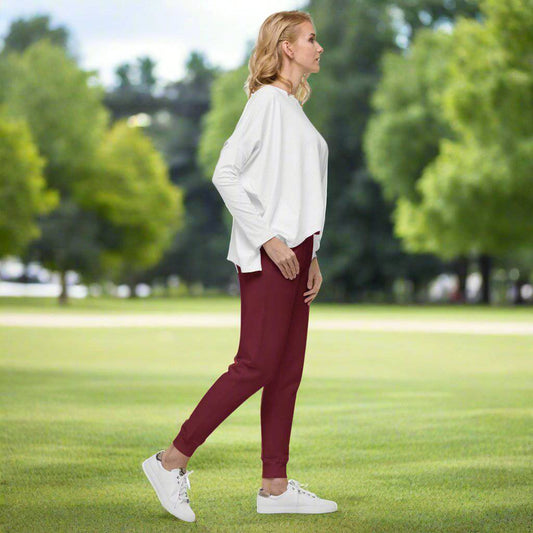 Maroon Luxe Sweatpants paired with casual sneakers – stylish and comfy.