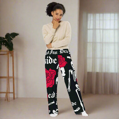 Unisex wide-leg lounge pants with black skeleton print - front view.