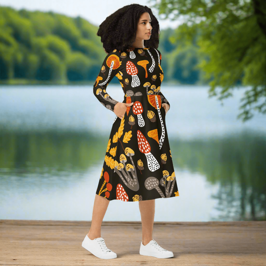 Whimsical Forest Midi Dress featuring bold mushroom motifs, long sleeves, and a flattering fit, side view.